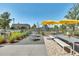 Enjoy outdoor relaxation in this community space with umbrellas and seating areas at 13618 Briand Ave, Orlando, FL 32827