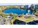 Aerial view of Lake Eola Park, fountain, Walt Disney Amphitheater, and downtown cityscape at 150 E Robinson St # 4A, Orlando, FL 32801