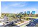 Scenic balcony view overlooking a park, lake, and the distant city skyline at 150 E Robinson St # 4A, Orlando, FL 32801
