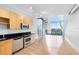 Modern kitchen with stainless steel appliances, natural light, and spiral staircase to the loft at 150 E Robinson St # 4A, Orlando, FL 32801