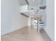 Bright living room featuring wood floors, a spiral staircase, and loft access at 150 E Robinson St # 4A, Orlando, FL 32801