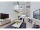 Cozy living room with spiral staircase, modern decor, and view of loft space at 150 E Robinson St # 4A, Orlando, FL 32801