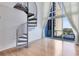 Bright loft space featuring natural light and spiral staircase leading to the main living area at 150 E Robinson St # 4A, Orlando, FL 32801