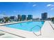 Beautiful rooftop pool area with lounge chairs and city views at 150 E Robinson St # 4A, Orlando, FL 32801