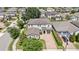An aerial view shows the beautiful home, surrounding neighborhood, large driveway, and well-maintained landscaping at 16753 Gullfloss Ter, Winter Garden, FL 34787
