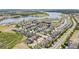 Aerial view of a residential area with a mix of homes and nearby lake at 16753 Gullfloss Ter, Winter Garden, FL 34787