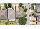 Aerial view of homes in a neighborhood featuring well-manicured lawns, paved driveways and sidewalks at 16753 Gullfloss Ter, Winter Garden, FL 34787