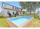 Beautiful backyard featuring a large pool, patio area, and lush green grass at 16753 Gullfloss Ter, Winter Garden, FL 34787