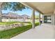 Spacious backyard with a covered patio and a lush lawn, perfect for outdoor enjoyment at 16753 Gullfloss Ter, Winter Garden, FL 34787