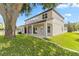 Well-manicured backyard featuring a covered patio and lush lawn, offering a serene outdoor space at 16753 Gullfloss Ter, Winter Garden, FL 34787