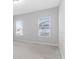 A bright and airy bedroom with two windows at 16753 Gullfloss Ter, Winter Garden, FL 34787