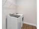 Bright laundry room featuring wood look tile floors and new washer and dryer units at 16753 Gullfloss Ter, Winter Garden, FL 34787
