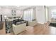 Open living room featuring stylish furniture, hardwood flooring, and a decorative rug at 16753 Gullfloss Ter, Winter Garden, FL 34787