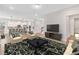 Spacious living room showcasing modern decor, with seamless open to the kitchen at 16753 Gullfloss Ter, Winter Garden, FL 34787