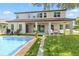 Backyard featuring a sparkling pool, patio area, and well-maintained landscaping at 16753 Gullfloss Ter, Winter Garden, FL 34787