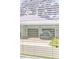 Window view of the garage featuring blinds at 16753 Gullfloss Ter, Winter Garden, FL 34787
