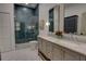 Modern bathroom with double vanity, stylish tile, and a glass shower at 1740 Cherry Ridge Dr, Lake Mary, FL 32746
