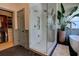Spacious bathroom with glass shower, soaking tub, walk-in closet, and herringbone-patterned floor at 1740 Cherry Ridge Dr, Lake Mary, FL 32746