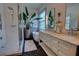 Bright bathroom with a glass shower, soaking tub, and double vanity with marble countertop at 1740 Cherry Ridge Dr, Lake Mary, FL 32746