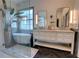 Contemporary bathroom featuring double vanity with marble countertop, large potted plant and soaking tub at 1740 Cherry Ridge Dr, Lake Mary, FL 32746
