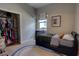 Neutral bedroom showcasing a built-in closet and window allowing natural light at 1740 Cherry Ridge Dr, Lake Mary, FL 32746