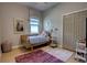 Cozy bedroom with a closet, large window, and unique decorations at 1740 Cherry Ridge Dr, Lake Mary, FL 32746