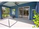 Covered patio with an inviting seating area and view of the well-maintained backyard at 1740 Cherry Ridge Dr, Lake Mary, FL 32746