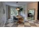 Bright dining room featuring modern pendant lighting, neutral accents, and serene outdoor views at 1740 Cherry Ridge Dr, Lake Mary, FL 32746