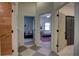 Bright hallway featuring modern flooring and views into two separate bedrooms at 1740 Cherry Ridge Dr, Lake Mary, FL 32746