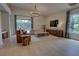 Bright and spacious living room with stylish furniture, modern decor, and scenic backyard views at 1740 Cherry Ridge Dr, Lake Mary, FL 32746