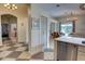 Bright open-concept living space featuring stylish chandelier and view of the screened-in pool area at 1740 Cherry Ridge Dr, Lake Mary, FL 32746