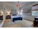 Bright main bedroom featuring king-size bed, modern artwork, and an abundance of natural light at 1740 Cherry Ridge Dr, Lake Mary, FL 32746