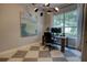 Home office with checkered floors, modern lighting, and a view of the exterior landscape at 1740 Cherry Ridge Dr, Lake Mary, FL 32746