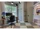 Well-lit home office with checkered floors, modern lighting, and closet storage space at 1740 Cherry Ridge Dr, Lake Mary, FL 32746
