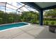 Inviting screened pool area with comfortable lounge space, and view of the backyard at 1740 Cherry Ridge Dr, Lake Mary, FL 32746