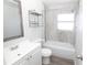Spotless bathroom featuring modern fixtures, a tub with shower, and updated vanity at 1831 Aaron Ave, Orlando, FL 32811
