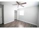 Bedroom featuring wood-look flooring, ceiling fan and closet at 1831 Aaron Ave, Orlando, FL 32811