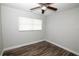 Bedroom featuring wood-look flooring, neutral paint and natural light at 1831 Aaron Ave, Orlando, FL 32811