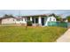 Charming home featuring well-maintained landscaping and covered front porch at 1831 Aaron Ave, Orlando, FL 32811