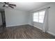 Living room featuring modern flooring and large windows with curtains at 1831 Aaron Ave, Orlando, FL 32811