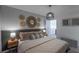 Comfortable bedroom with stylish decor, a plush bed, and unique wall decor at 2004 Fleming Mist Pl, Kissimmee, FL 34747