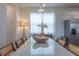 Elegant dining area featuring modern light fixture, a bright window and natural light at 2004 Fleming Mist Pl, Kissimmee, FL 34747
