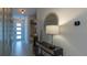 Bright entryway with modern console table, decor, and natural lighting, offering a welcoming ambiance at 2004 Fleming Mist Pl, Kissimmee, FL 34747