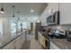 Bright kitchen features stainless steel appliances, sleek countertops, and ample storage space at 2004 Fleming Mist Pl, Kissimmee, FL 34747