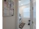 Bright laundry room featuring modern washer and dryer, tile flooring, and a decorative accent rug at 2004 Fleming Mist Pl, Kissimmee, FL 34747