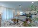Open concept living room, seamlessly connected to the kitchen and dining area at 2004 Fleming Mist Pl, Kissimmee, FL 34747