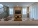 Stylish living room with comfortable seating, decorative rug, and bright windows at 2004 Fleming Mist Pl, Kissimmee, FL 34747