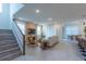 Spacious living room features high ceilings, neutral color palette, contemporary decor, and tile floors at 2004 Fleming Mist Pl, Kissimmee, FL 34747