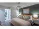 Spacious main bedroom features a stylish decor, ambient lighting, and an open door to a cozy bedroom at 2004 Fleming Mist Pl, Kissimmee, FL 34747
