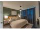 Comfortable main bedroom features stylish decor, ambient lighting, and modern accents, creating a tranquil retreat at 2004 Fleming Mist Pl, Kissimmee, FL 34747